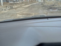 В Авиаторе дорогу ада засыпали асфальтной крошкой